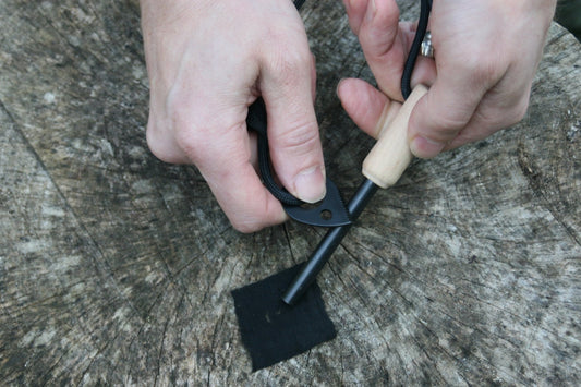 Master the Spark: The Ultimate Guide to Using Flint and Steel with Charcloth - Purple Mallet